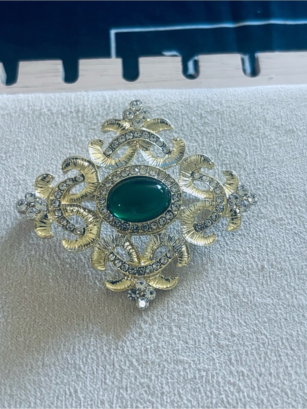 Ornate Silver-Tone Brooch with Emerald Green Cabochon Brooch